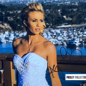 Aqueela Zoll Autograph in black ink mid-right on 10x8 colour promo photo in white dress overlooking marina, excellent condition with COA