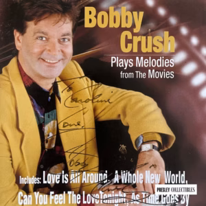 Bobby Crush Autograph: Plays Melodies From The Movies signed CD inlay, product details, COA included, Buy piano music memorabilia from Presley Collectibles with tracked worldwide delivery.