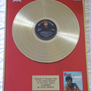 Elvis Presley Clambake. Elvis Presley Clambake gold record presentation in very good condition – authentic music award presentation with worldwide shipping and market leading 90-day money back guarantee.