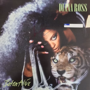 Diana Ross Time Limited Sale. Signed Diana Ross “Eaten Alive” 1985 UK Capitol Records vinyl LP, showing the original album sleeve hand-signed in blue ink with the record in very good condition, offered as authentic music memorabilia by Presley Collectibles.