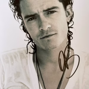 Orlando Bloom hand-signed 11.75″ x 8.25″ black and white promo photo in excellent in black sharpie – authentic movie autograph with Certificate of Authenticity (COA)