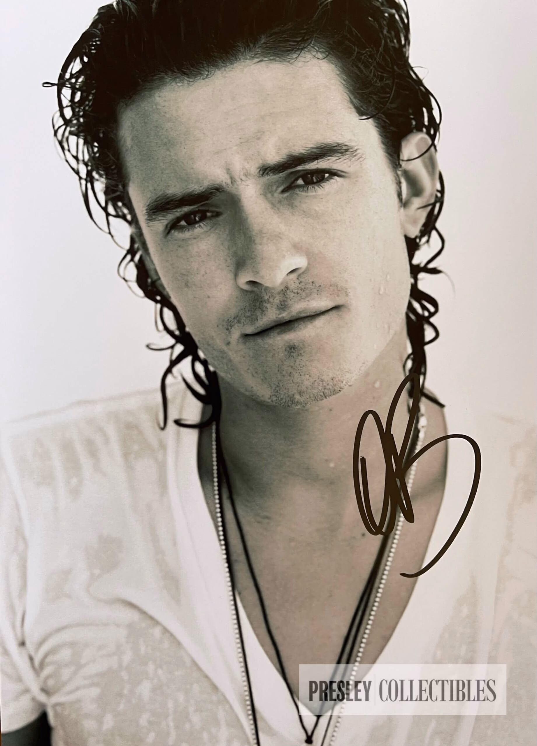 Orlando Bloom hand-signed 11.75″ x 8.25″ black and white promo photo in excellent in black sharpie – authentic movie autograph with Certificate of Authenticity (COA)