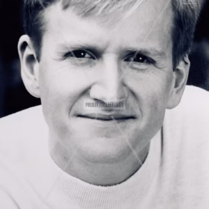 Black and white promotional photograph of Matthew Cottle wearing a white t-shirt and smiling at camera, Matthew Cottle Autograph in black ink, COA, provenance and worldwide shipping.