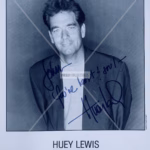 Huey Lewis Autograph on 8x10 Aaron Rapoport Bob Brown Management black‑and‑white promo photo, blue ink inscription and COA from Presley Collectibles.