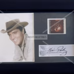 Elvis Presley Film Cell framed display featuring original film cell and plaque.