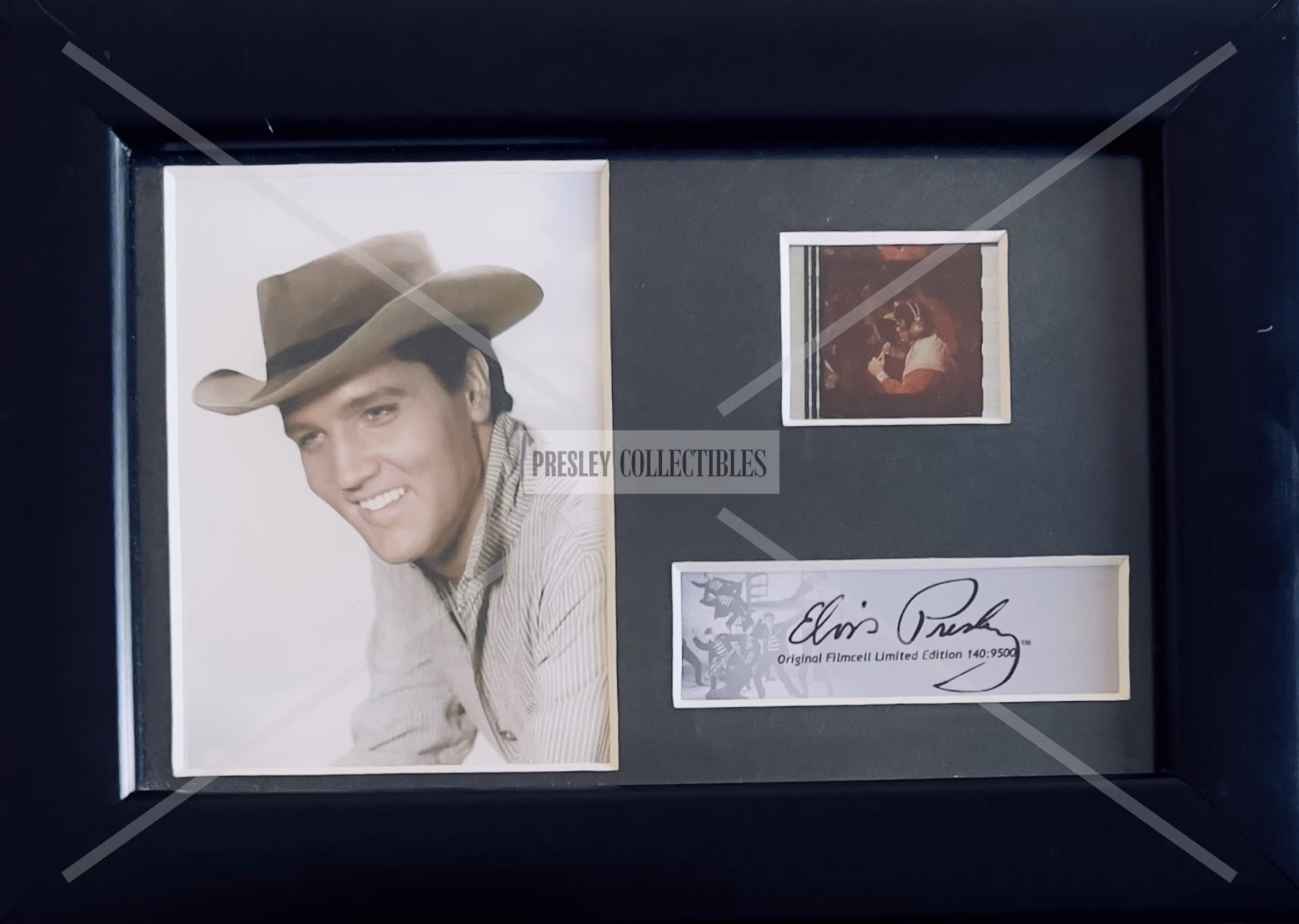 Elvis Presley Film Cell framed display featuring original film cell and plaque.