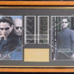 Matrix Duet Film Cells — framed 35mm film cell display with posters, plaque, COA, very good condition, 14.5” x 9”.
