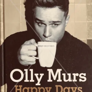 Olly Murs Autograph on a personalised Happy Days hardback autobiography, signed in black ink with smiley face and love heart, COA, and worldwide shipping.